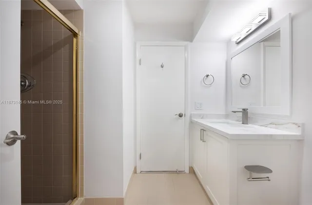 a bathroom with a sink and mirror