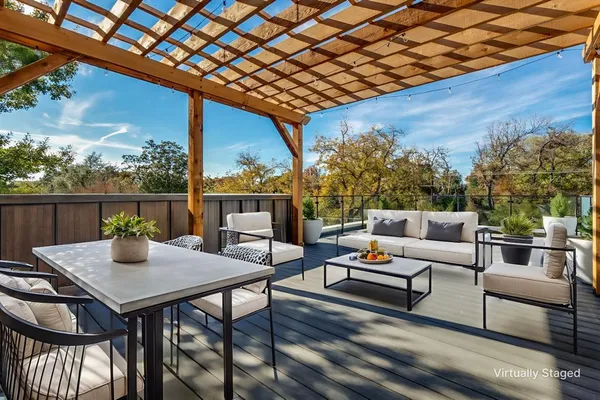 a outdoor living space with furniture and wooden floor