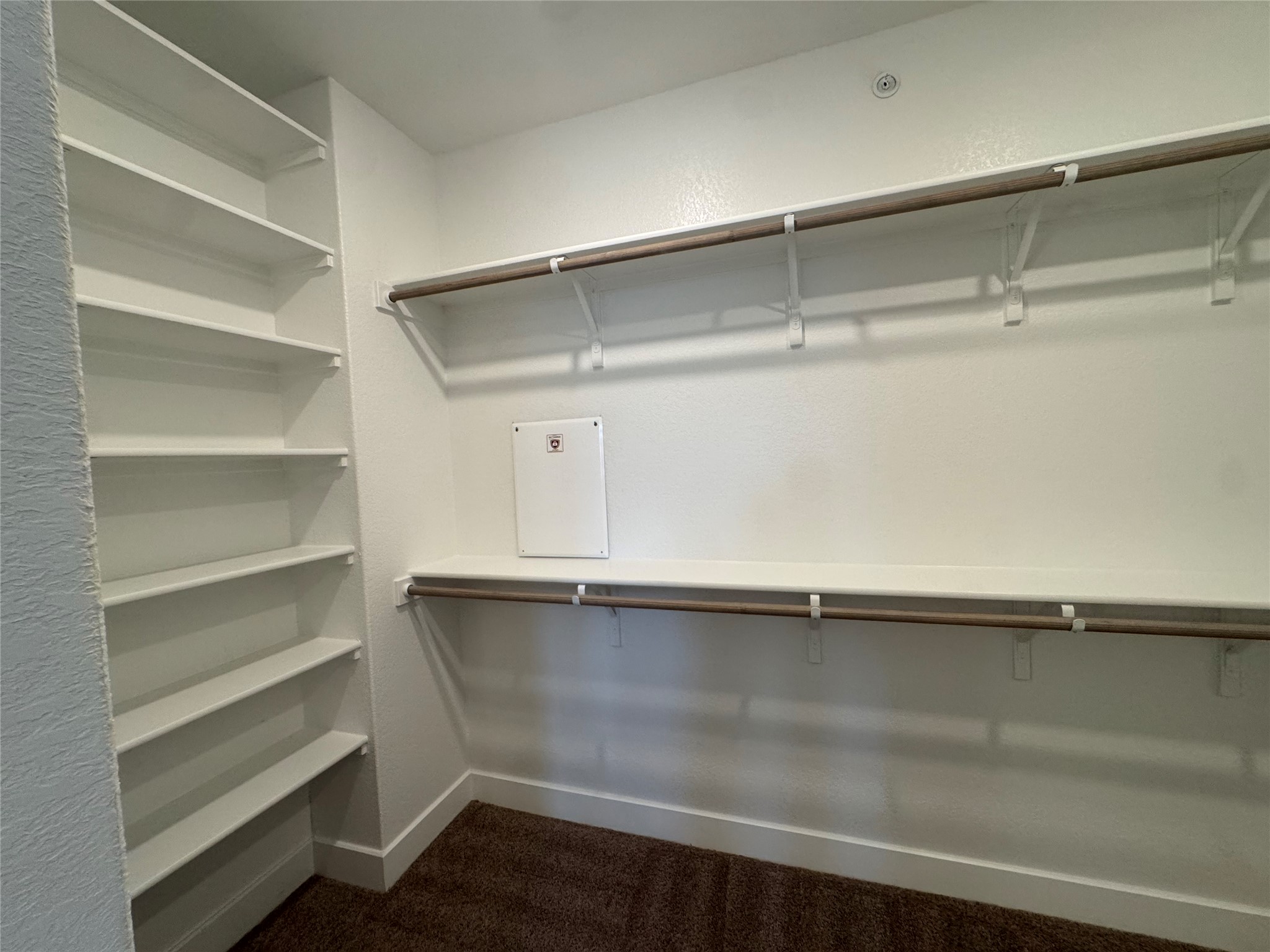 3000 Chisholm Trail Road, Unit 23 Round Rock, TX 78681 - Photo 16 of 26 Discover abundant storage with built-in shelving and dual hanging rods in this well-appointed closet.