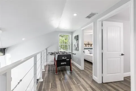 a view of workspace with wooden floor and furniture