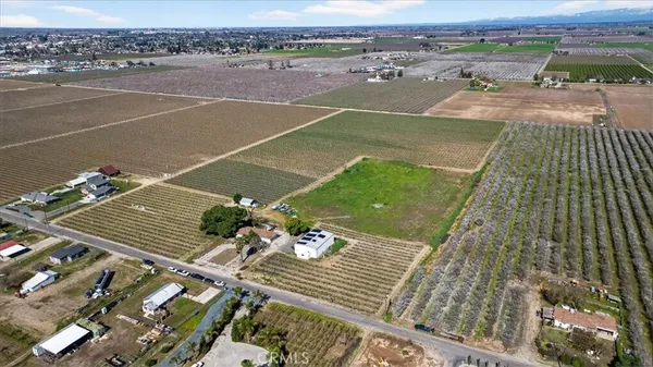 a view of a terrace with wooden floor and a mountain view
