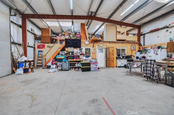 a room with furniture and flat screen tv