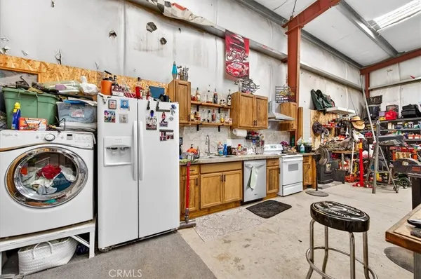a kitchen with a sink and refrigerator