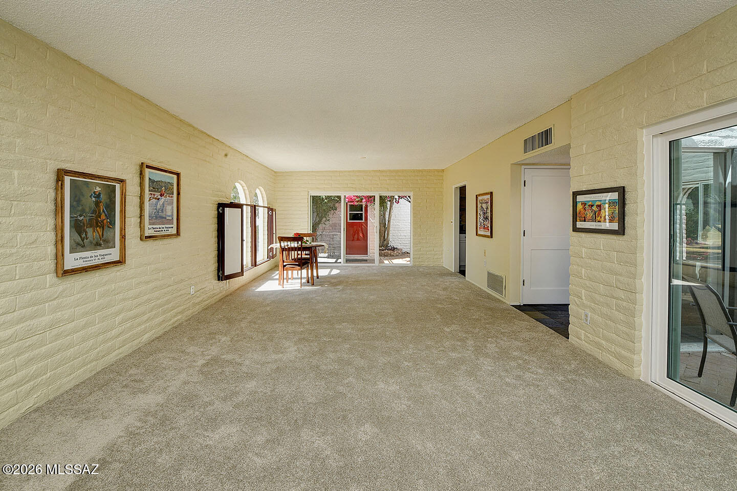 719 West Las Lomitas Road Tucson, AZ 85704 - Photo 18 of 44 a view of a livingroom with hardwood floor and a ceiling fan