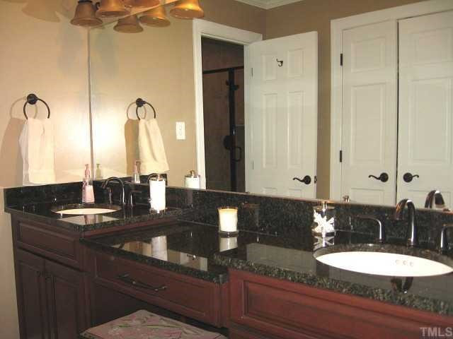7116 Rainwater Road Raleigh, NC 27615 - Photo 9 of 12 Luxurious master bath with new vanity, hardware, fixtures, & tile shower Master Bath/Spa