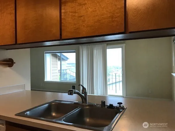 a kitchen with a sink and cabinets
