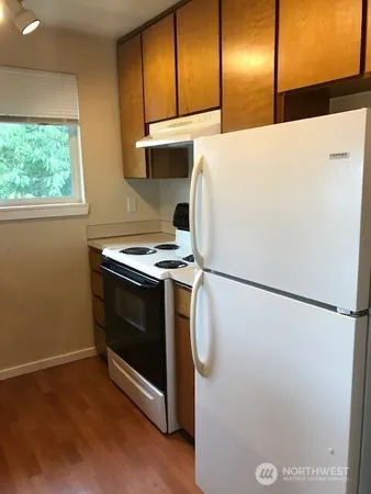 a view of a kitchen with a sink