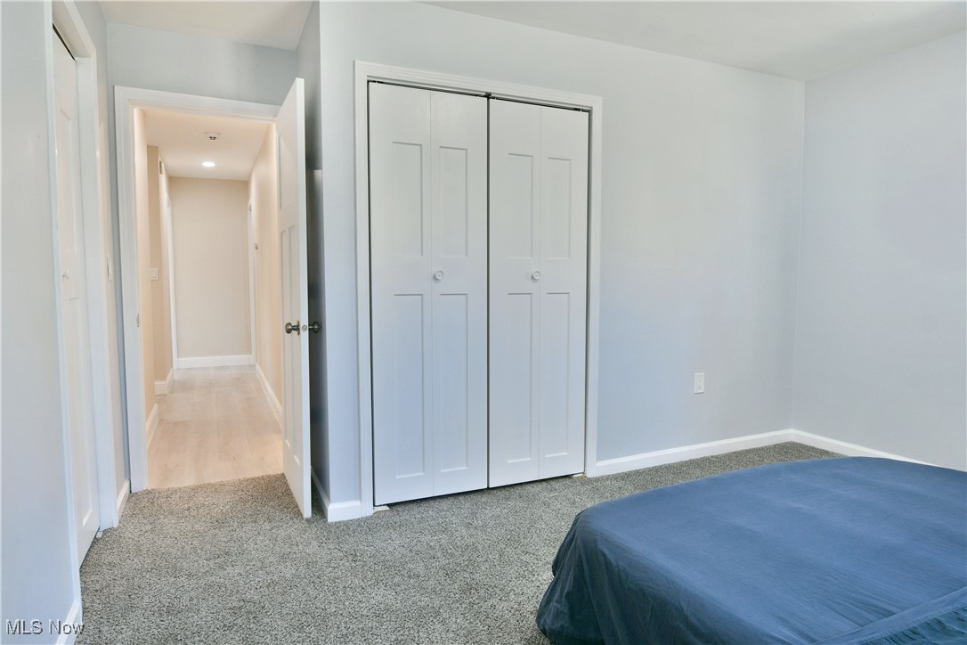 9633 Howland Springs Road Southeast Warren, OH 44484 - Photo 36 of 50 Bedroom with light carpet and baseboards