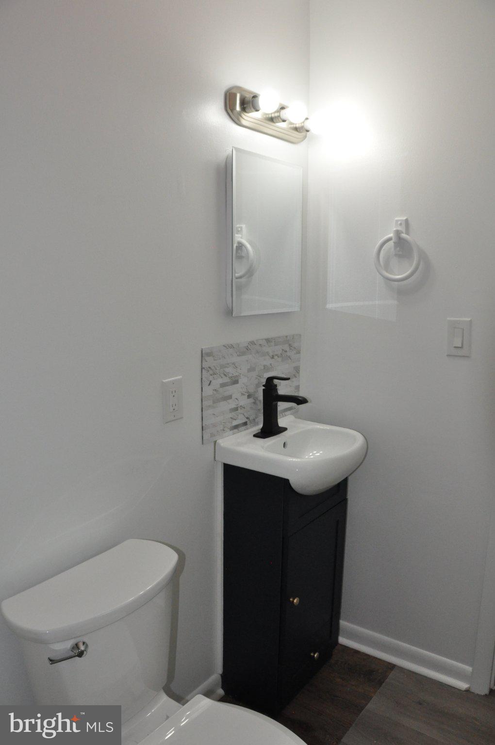 28 Henry Way Linden, VA 22642 - Photo 19 of 39 a bathroom with a toilet a sink and mirror
