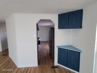 a view of hallway with wooden floor