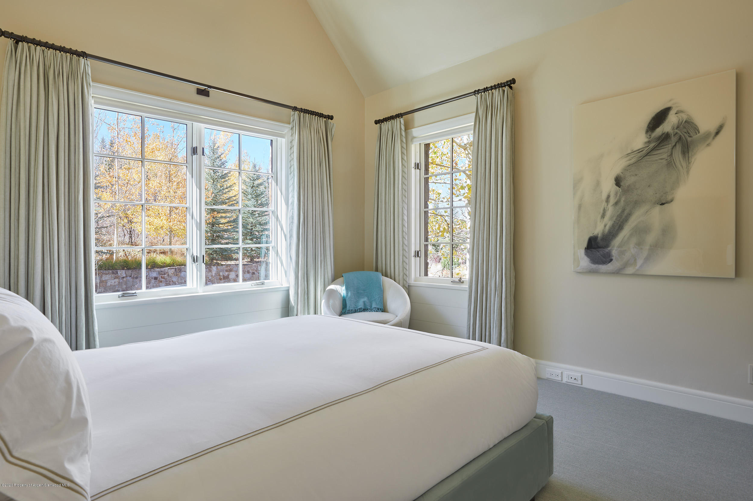 864 Moore Drive Aspen, CO 81611 - Photo 18 of 37 a bedroom with a large bed and a window