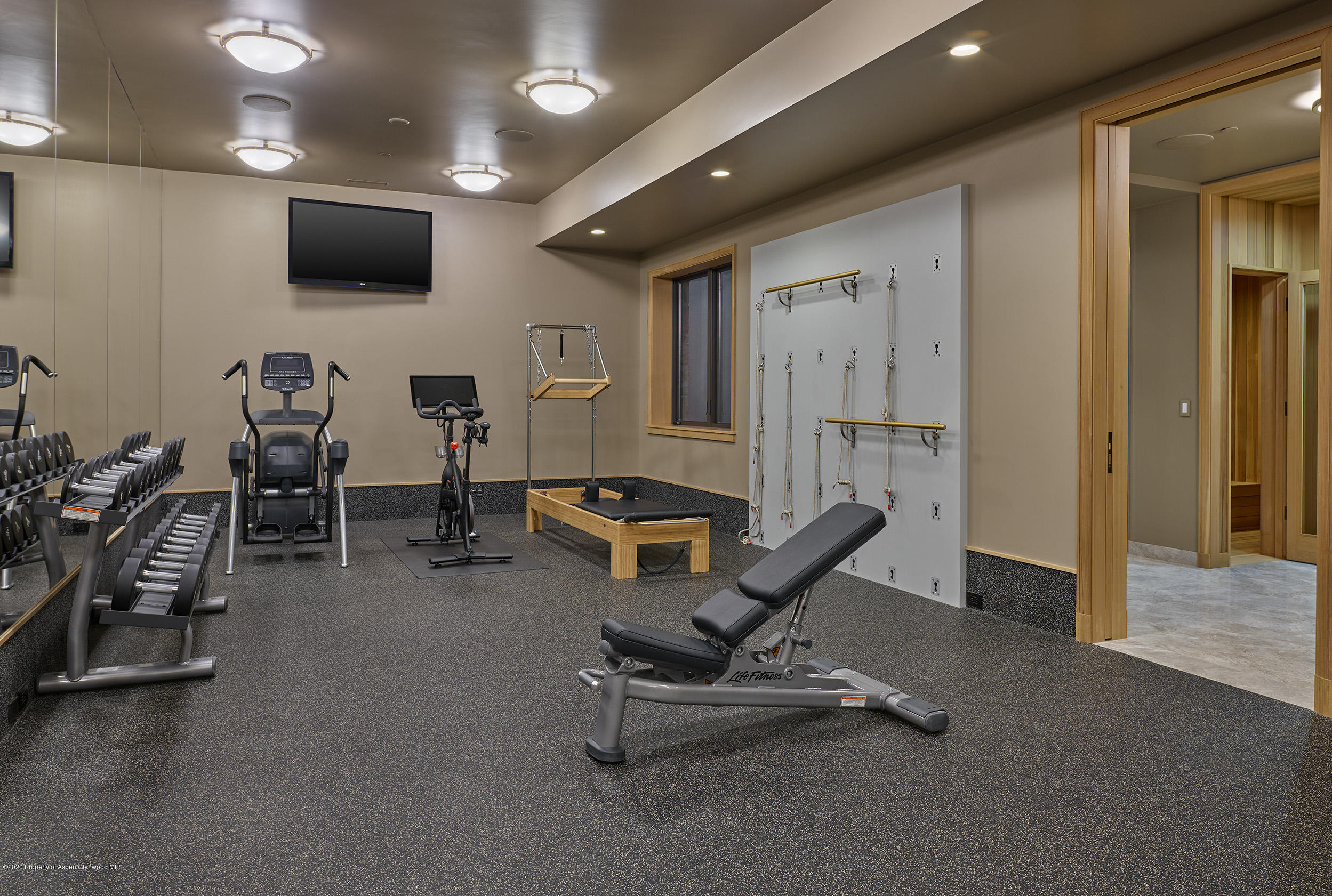 864 Moore Drive Aspen, CO 81611 - Photo 24 of 37 a living room with furniture pool and a flat screen tv
