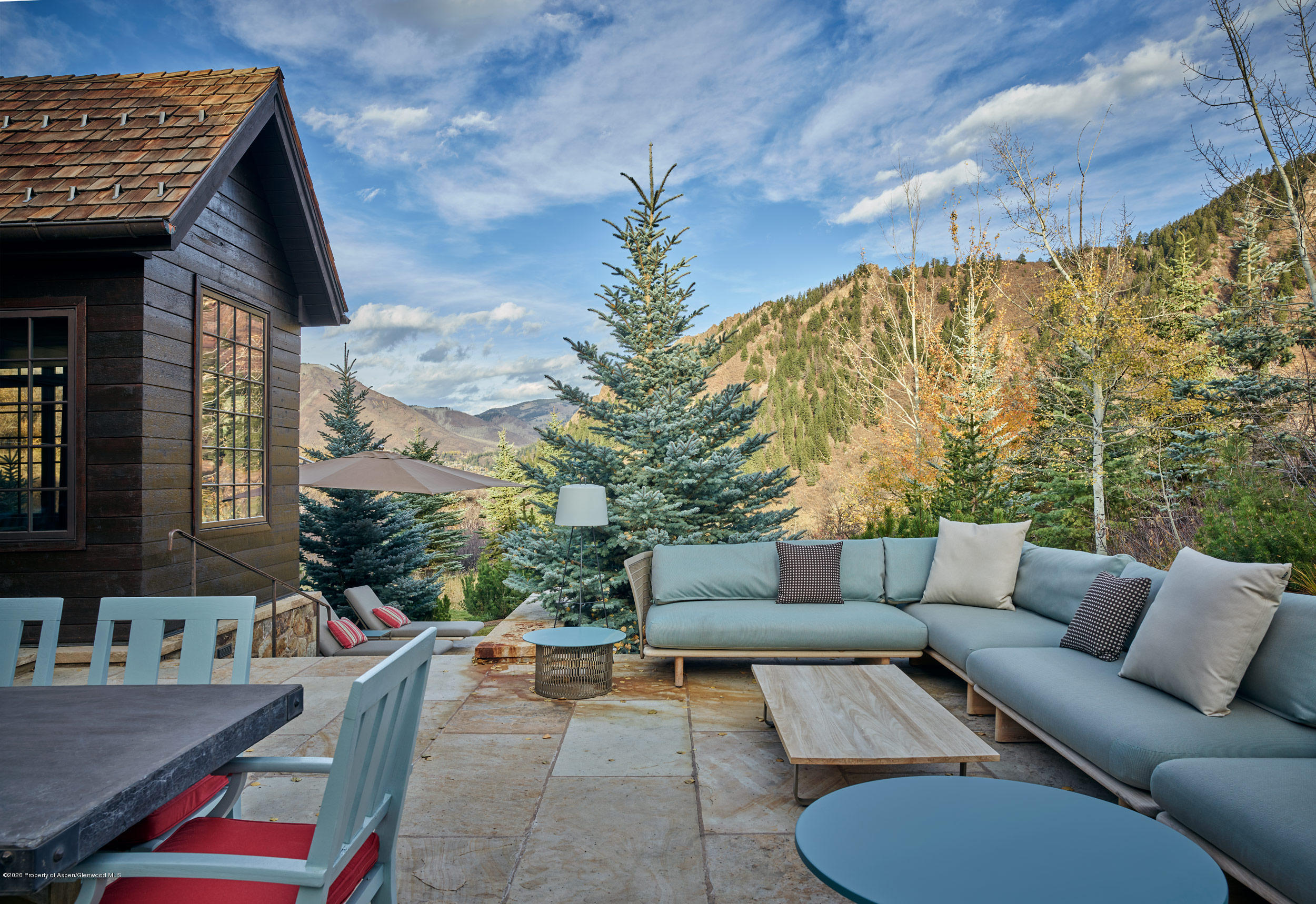 864 Moore Drive Aspen, CO 81611 - Photo 25 of 37 a backyard of a house with outdoor seating