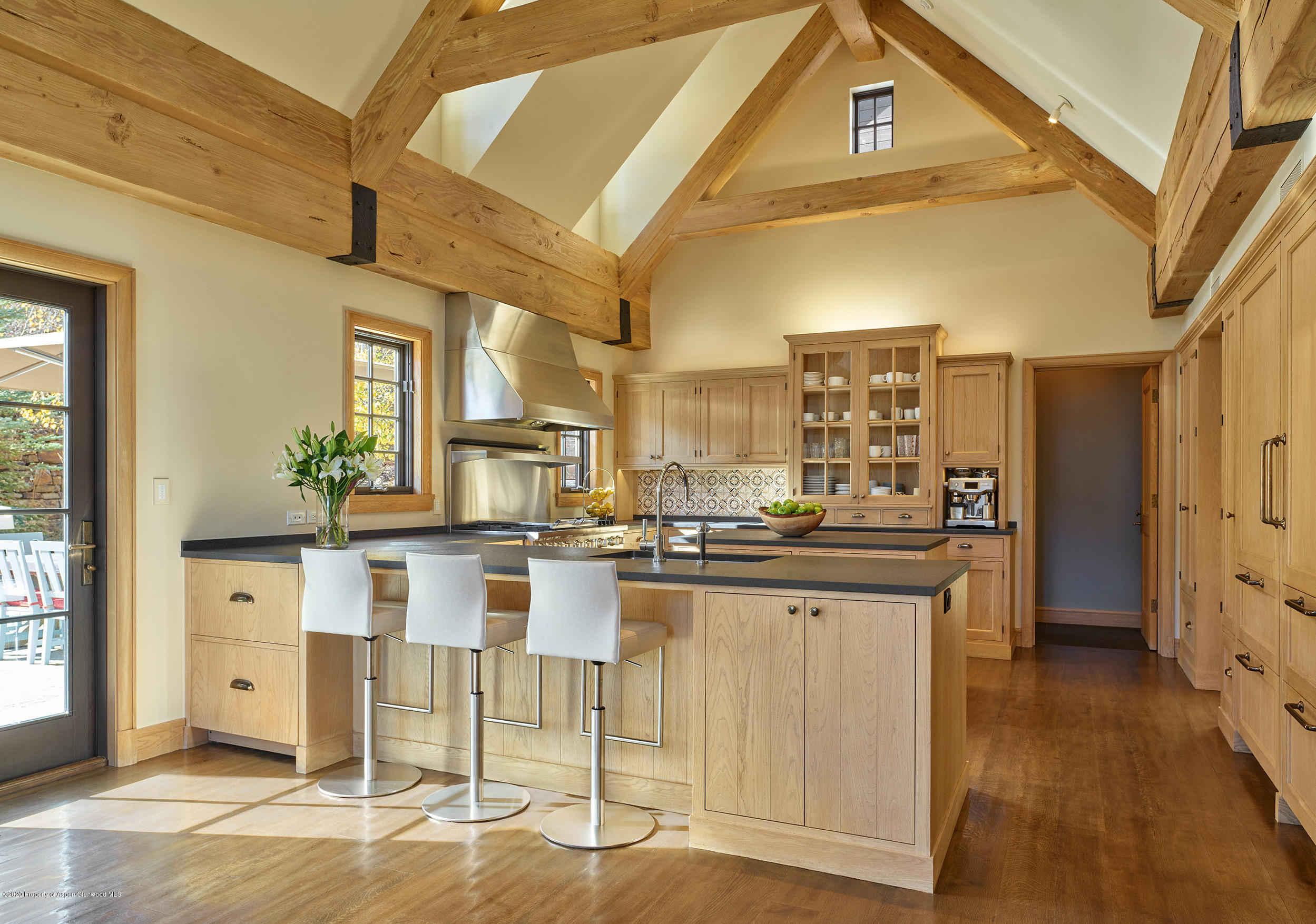 864 Moore Drive Aspen, CO 81611 - Photo 6 of 37 a kitchen with cabinets and chairs