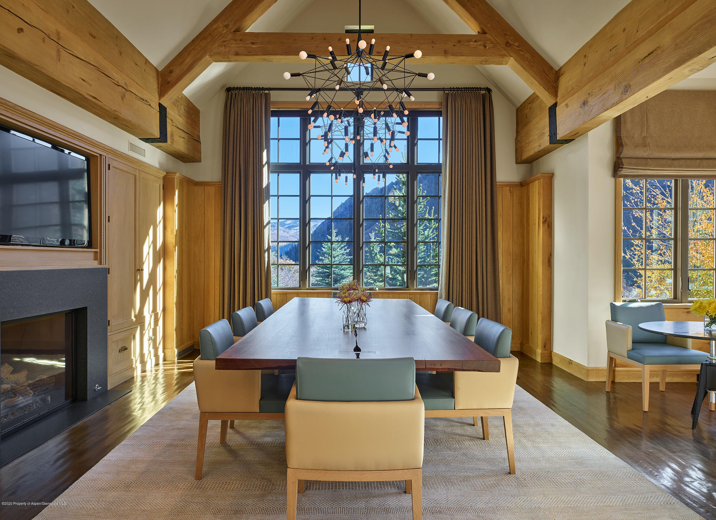 864 Moore Drive Aspen, CO 81611 - Photo 7 of 37 a view of a dining room with furniture window and wooden floor