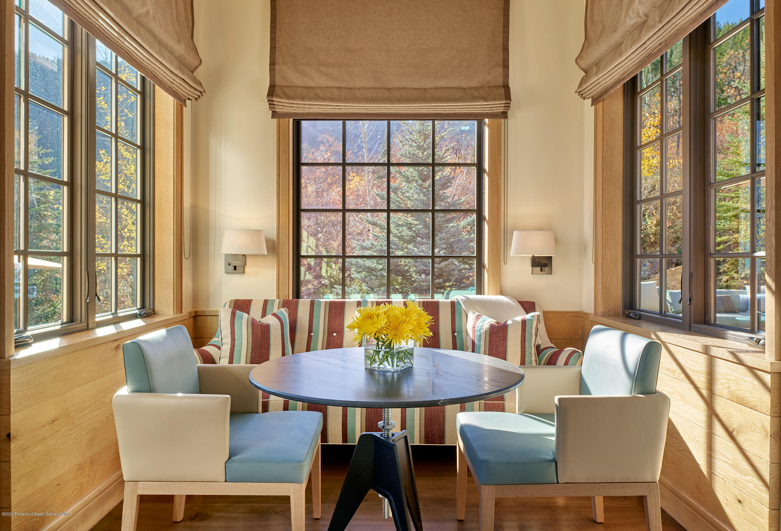 864 Moore Drive Aspen, CO 81611 - Photo 10 of 37 a view of a dining room with furniture and a large window