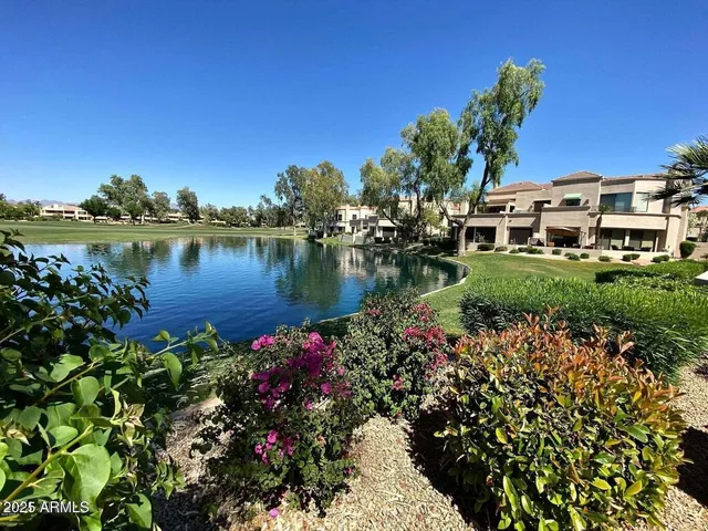 a view of a lake with a house in the background