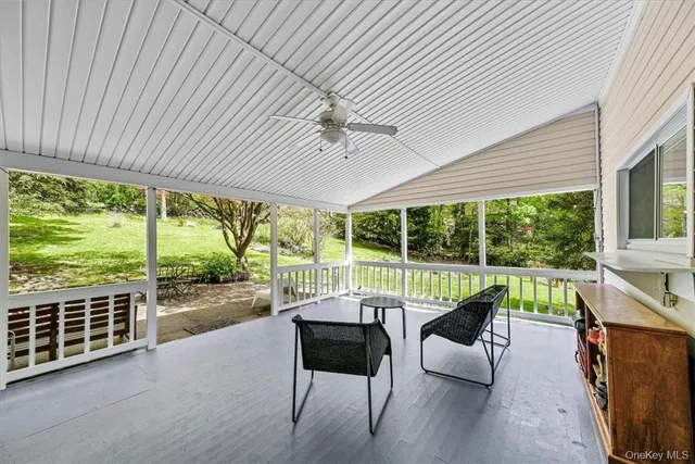 a sitting area with furniture and wooden deck