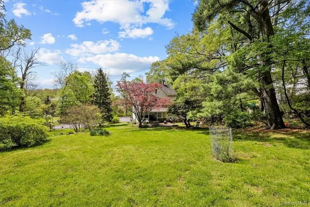 a backyard of a house with lots of green space