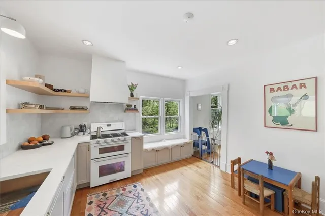 a kitchen with a stove a sink and a refrigerator
