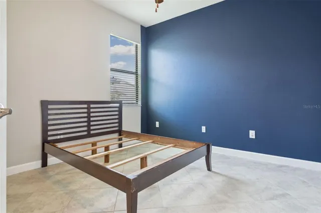 a view of a room with a table and chairs