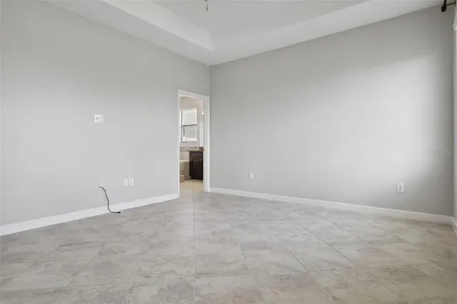 a bathroom with a sink vanity tub and a mirror