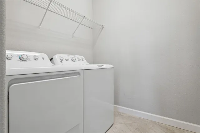 a living room with couch and a large window