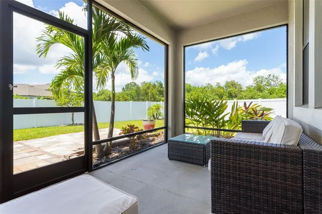 a spacious bedroom with a bed and a large window