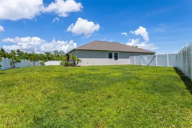 a view of a backyard of the house