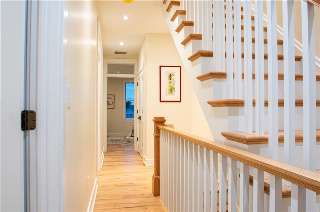 212 South Mathilda Street Pittsburgh, PA 15224 - Photo 16 of 38 a view of a hallway with wooden floor and a bathroom