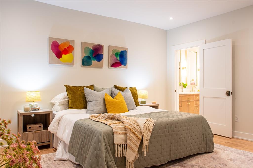 212 South Mathilda Street Pittsburgh, PA 15224 - Photo 18 of 38 a bedroom with a bed and cupboard