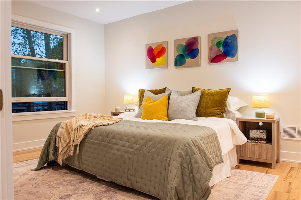 212 South Mathilda Street Pittsburgh, PA 15224 - Photo 20 of 38 a bedroom with a bed and a painting on the wall