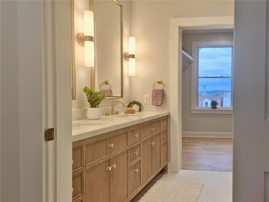 212 South Mathilda Street Pittsburgh, PA 15224 - Photo 23 of 38 a bathroom with a sink and a mirror