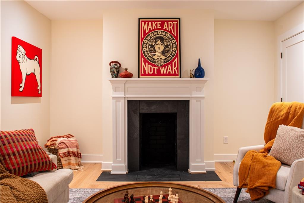 212 South Mathilda Street Pittsburgh, PA 15224 - Photo 29 of 38 a living room with furniture and a fireplace