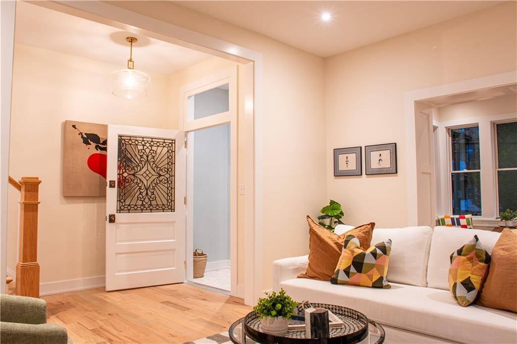 212 South Mathilda Street Pittsburgh, PA 15224 - Photo 3 of 38 a living room with furniture and a wooden floor