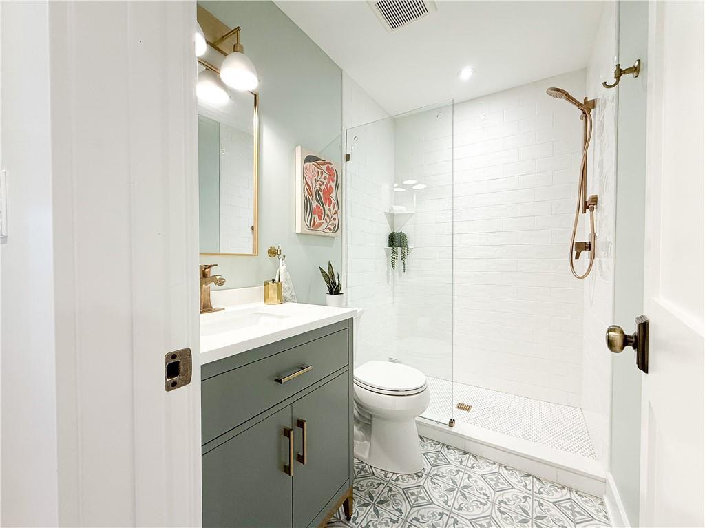 212 South Mathilda Street Pittsburgh, PA 15224 - Photo 31 of 38 a bathroom with a granite countertop sink toilet and shower