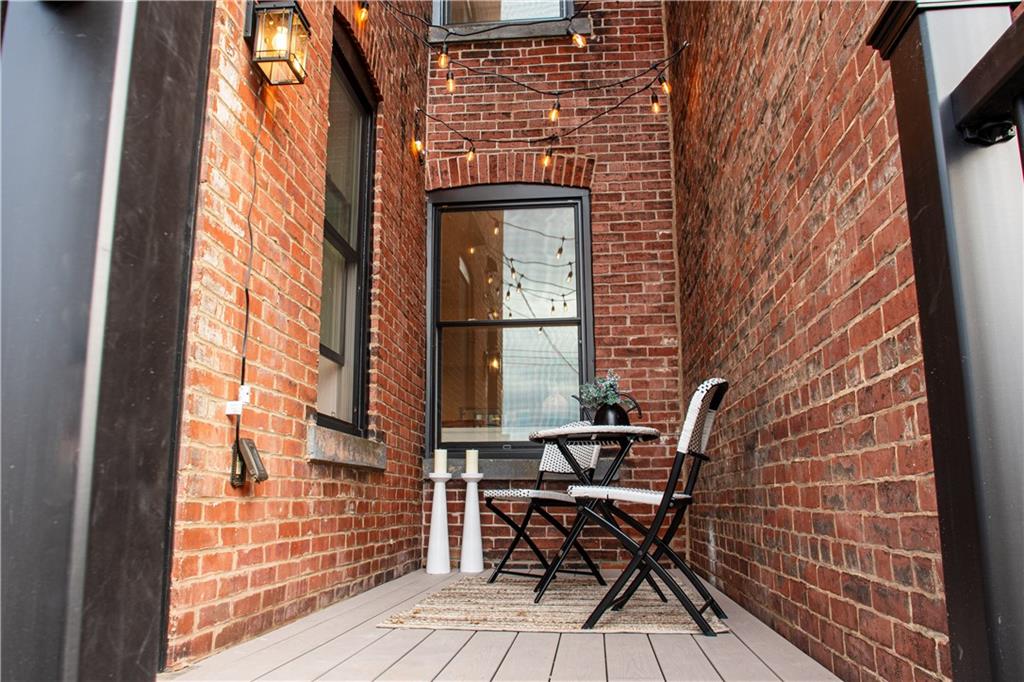 212 South Mathilda Street Pittsburgh, PA 15224 - Photo 37 of 38 a brick building with a bench and a window