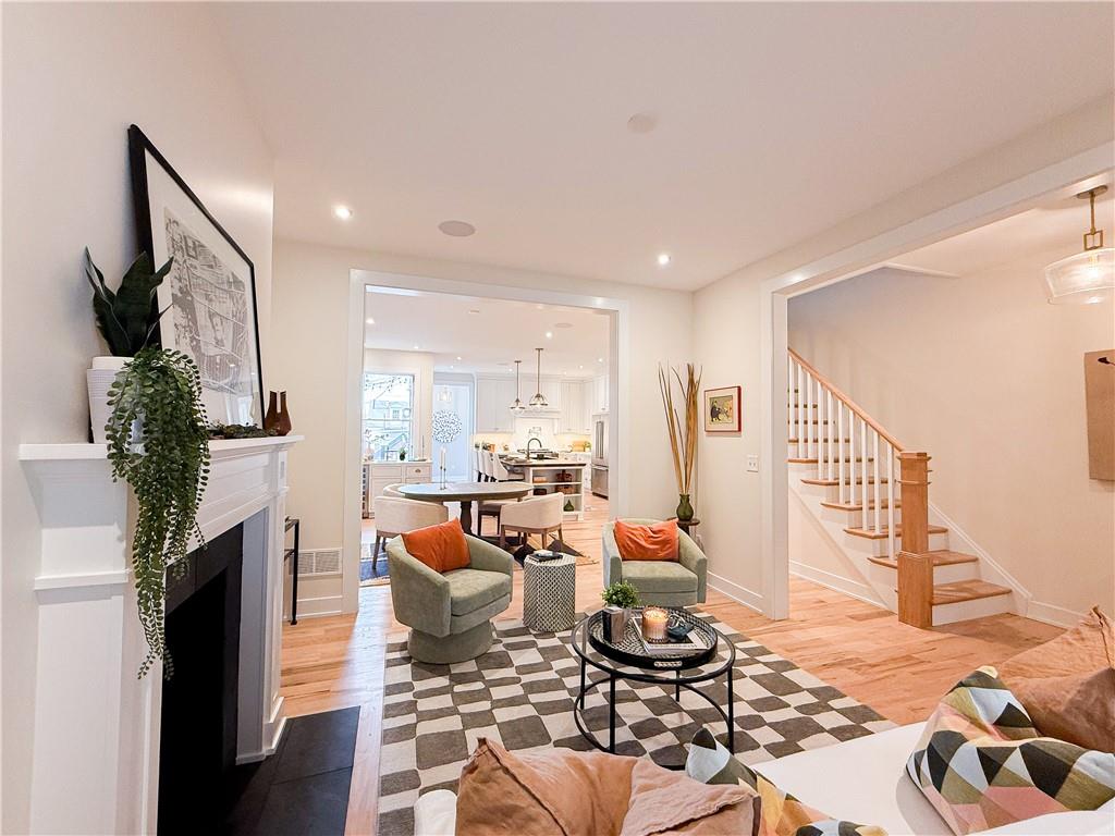 212 South Mathilda Street Pittsburgh, PA 15224 - Photo 4 of 38 a living room with furniture and a fireplace