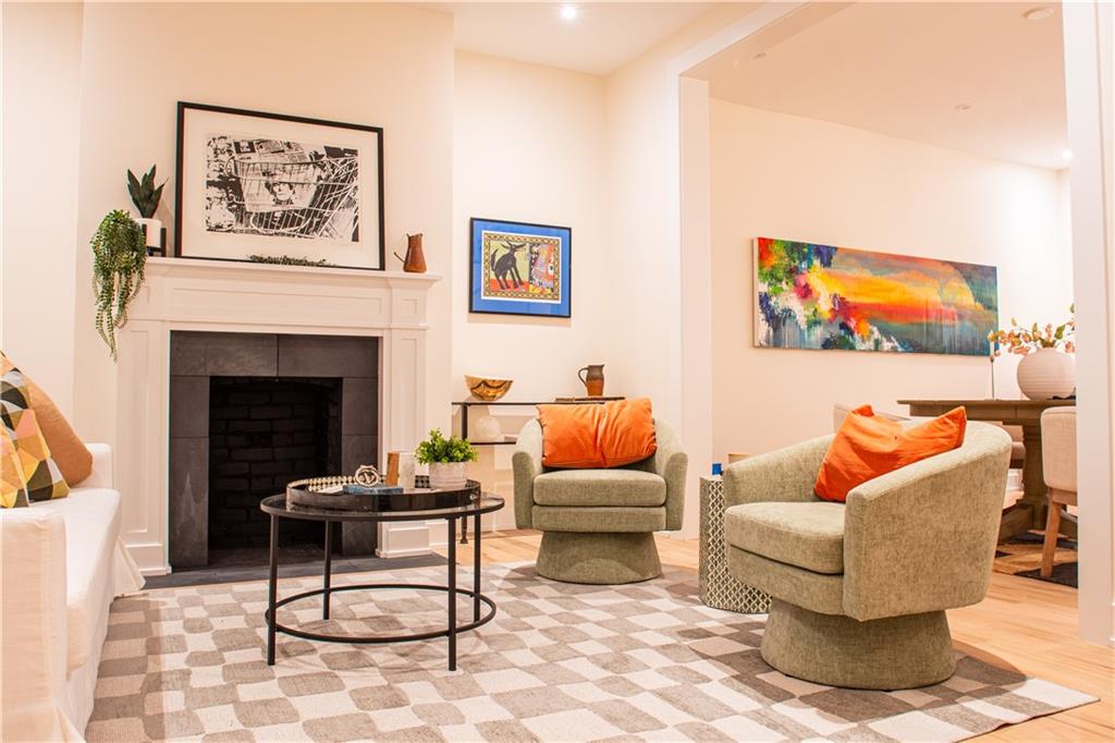 212 South Mathilda Street Pittsburgh, PA 15224 - Photo 5 of 38 a living room with furniture and a fireplace