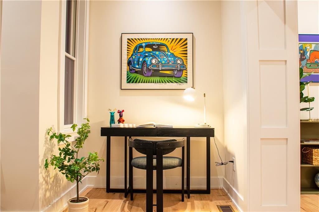 212 South Mathilda Street Pittsburgh, PA 15224 - Photo 8 of 38 a glass door with a painting on the wall and a potted plant