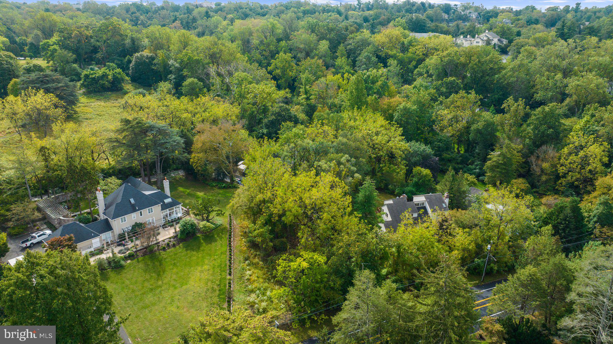 180 East Hillcrest Avenue Philadelphia, PA 19118 - Photo 23 of 32 an aerial view of residential houses with outdoor space and trees