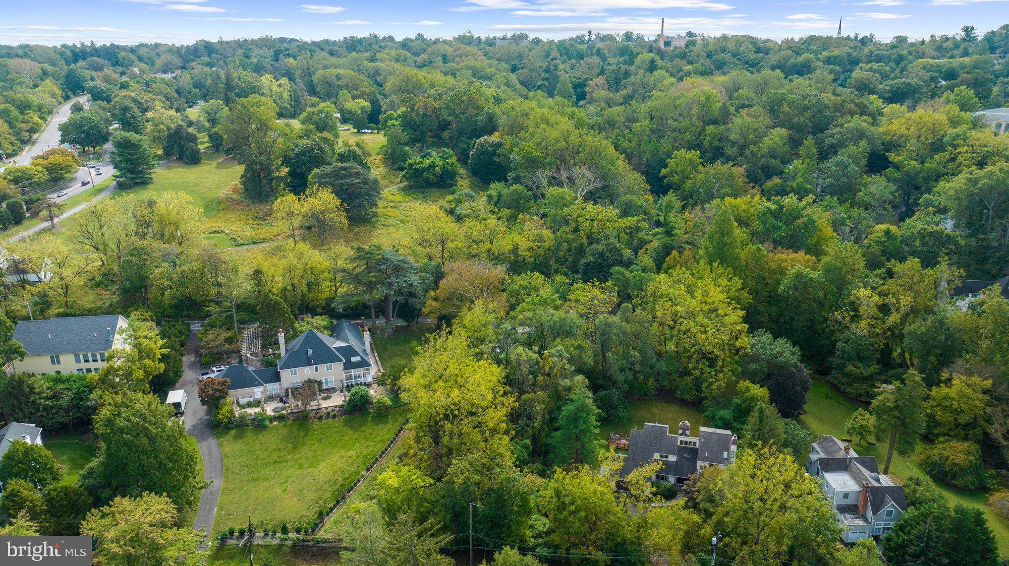 180 East Hillcrest Avenue Philadelphia, PA 19118 - Photo 25 of 32 an aerial view of residential houses with outdoor space and trees all around