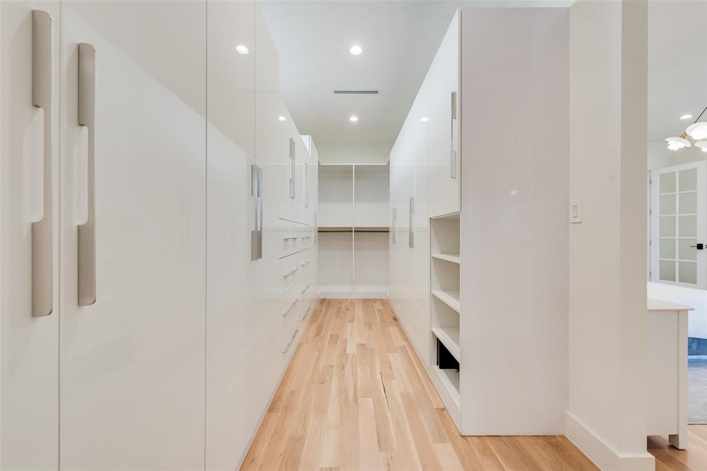 6411 Royal Lane Dallas, TX 75230 - Photo 17 of 35 a view of a hallway with wooden floor and staircase