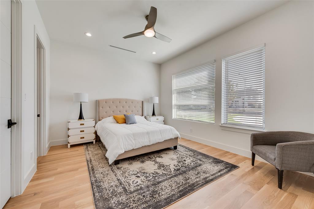 6411 Royal Lane Dallas, TX 75230 - Photo 21 of 35 a bedroom with a large bed and a window