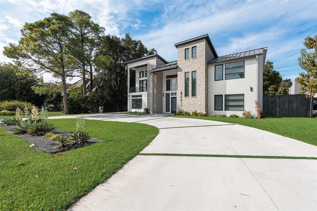 6411 Royal Lane Dallas, TX 75230 - Photo 34 of 35 a front view of a house with a yard