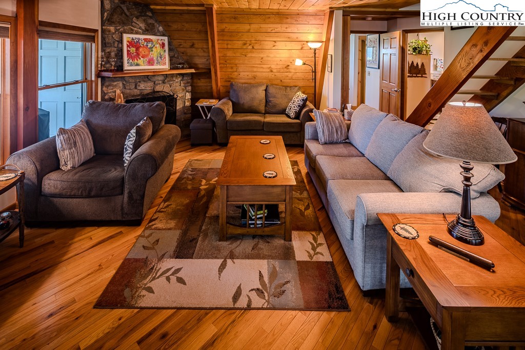 183 Rhododendron Loop Newland, NC 28657 - Photo 11 of 49 a living room with furniture and a lamp