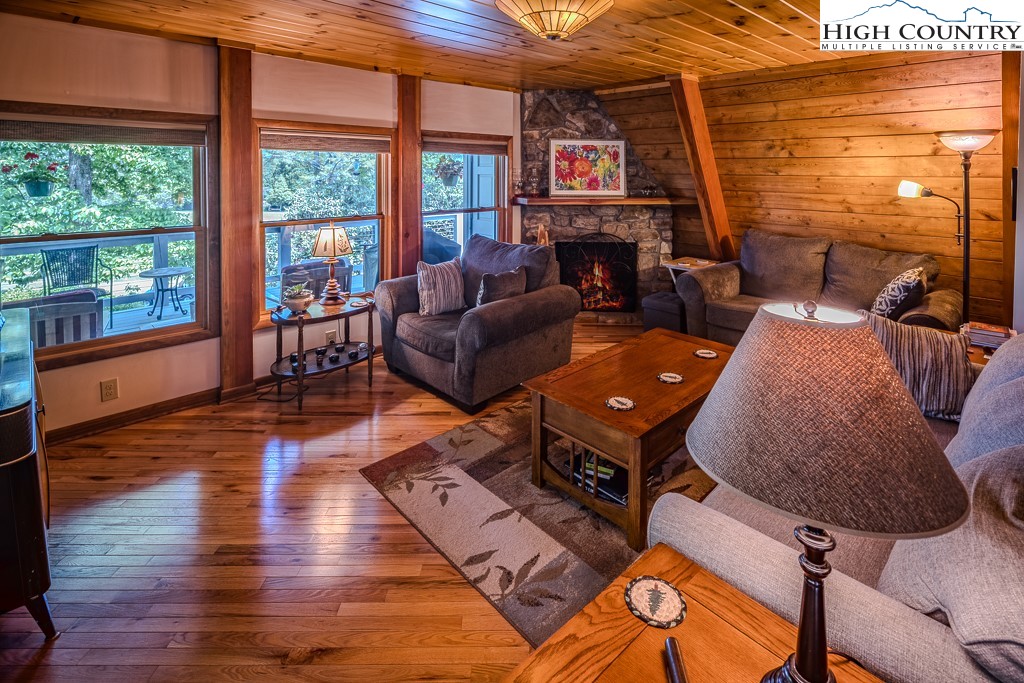 183 Rhododendron Loop Newland, NC 28657 - Photo 12 of 49 a living room with furniture fireplace and flat screen tv