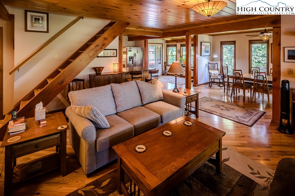 183 Rhododendron Loop Newland, NC 28657 - Photo 17 of 49 a living room with furniture next to a large window