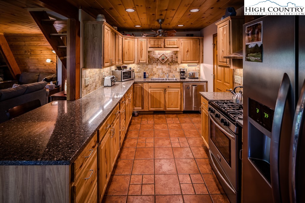 183 Rhododendron Loop Newland, NC 28657 - Photo 21 of 49 a kitchen with stainless steel appliances lots of counter top space