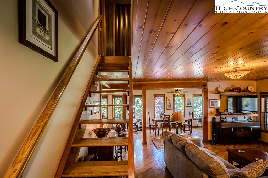183 Rhododendron Loop Newland, NC 28657 - Photo 26 of 49 a living room with furniture and wooden floor